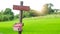 Wooden Signs and mail box hold wooden post on cornfield