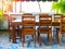 Wooden simple table and chairs on vintage tile floor