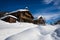 Wooden ski chalets in the snow