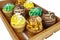 Wooden slated tray with delicious loaded cupcakes