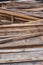 Wooden slats lie in a pile. Material for construction of wood