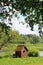 Wooden smokehouse in the farm by the pond. Wooden smokehouse in the countryside