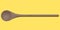 Wooden solid spoon or kitchen utensils on yellow background.
