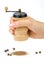 Wooden spice handmill in hand