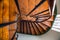 Wooden spiral staircase in old building, Paris, France