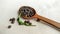 Wooden spoon with allspice, pepper, horseradish