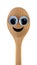 A wooden spoon with a cheerful smiling face.
