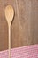 Wooden spoon and dish towel