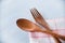 Wooden spoon and fork kitchenware set on napery on dining table - Zero waste use less plastic concept