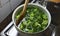 Wooden spoon inside a fresh green broccoli soup, healthy living, green