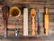 Wooden spoon, knife, rolling pin, turk for coffee, wooden mug and custard spoon for tea laid out on the table. Set of