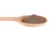 Wooden spoon with milled black pepper.