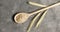 Wooden spoon with oats on table