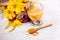 Wooden spoon with pollen and glass with pollen liquid