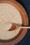Wooden spoon and quinoa grains