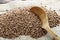 Wooden spoon of roasted buckwheat. gluten free ancient grain for healthy diet