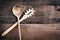 Wooden Spoon and Spaghetti Fork over Wood Background