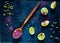 Wooden spoon with spice sumac and citrus fruit lime on vintage rusty metal background, ingredients for salads, top view,copy space