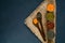 Wooden spoon and various cereals in metal cups , the concept of healthy eating.Top view. Rustic dark blue background