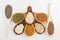 Wooden spoons with assorted grains of super foods, gluten free