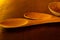 Wooden spoons and bowl on table.