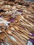 Wooden spoons lie on the surface with ornament. Various wooden utensils in vintage style. Household utensils are sold at the fair