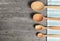 Wooden spoons with napkin on a rustic wooden table. Flat lay, top view, copy space banner