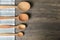 Wooden spoons with napkin on a rustic wooden table. Flat lay, top view, copy space banner