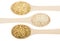 Wooden spoons with parboiled, polished, brown rices isolated on