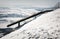 Wooden springboard for paragliders in snowy landscape