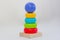 Wooden stacking toy. Development games for children. Colorful pyramid