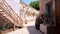 Wooden staircase and decorative bicycle on ancient street at old european city