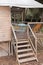 Wooden staircase elevated wooden bungalow safari hut cabin chalet in camping park