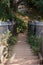 wooden staircase and fence for tourists to descend to a stream in the forest