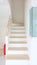 Wooden staircase in the new house with fire extinguisher installation