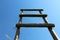 Wooden staircase stands on a background of blue sky