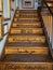Wooden staircase with welcome written in various world languages