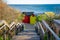 Wooden stairs leading down to iconic Brighton Beach huts.