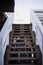 Wooden stairs leading to pier by sea