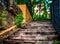 Wooden stairs in playground in marbella with stone wall