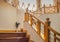 Wooden stairway with handrail and stainless banister