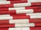 Wooden stakes in white and red