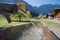 Wooden standpipe with fresh cold water, karwendel valley in autumn