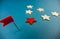 wooden stars and one red on a blue background with a red flag