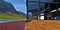 Wooden steps of the porch. Amazing glass facade in front of the picturesque mountains landscape. Red brick tile pavement. 3d