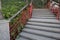 Wooden steps with red railing