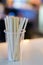 Wooden sticks in plastic cup for stirring sugar in coffee in cafeteria