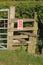 Wooden stile on footpath in countryside