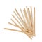 Wooden stirrers for coffee, tea and drinks, laid out in random order, isolated on a white background.