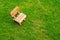 Wooden stool on green grass field